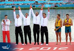 Karl Schulze (l), Phillipp Wende, Lauritz Schoof and Tim Grohmann (r) of Germany celebrate winning gold in the men's quadruple sculls at the 2012 Olympic Rowing Regatta at Eton-Dorney near London, Great Britain.