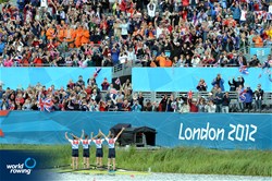 Peter Chambers (b), Rob Williams, Richard Chambers, and Chris Bartley (s) of Great Britain stand in the boat in celebration after winning silver in the lightweight men's four at the 2012 Olympic Rowing Regatta at Eton-Dorney near London, Great Britain.