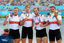 Karl Schulze (l), Phillipp Wende, Lauritz Schoof and Tim Grohmann (r) of Germany celebrate winning gold in the men's quadruple sculls at the 2012 Olympic Rowing Regatta at Eton-Dorney near London, Great Britain.