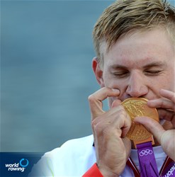 Karl Schulze of Germany celebrates winning gold in the men's quadruple sculls at the 2012 Olympic Rowing Regatta at Eton-Dorney near London, Great Britain.