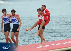 Mads Rasmussen and Rasmus Quist celebrate winning gold in the lightweight men's double sculls at the 2012 Olympic Rowing Regatta at Eton-Dorney near London, Great Britain.