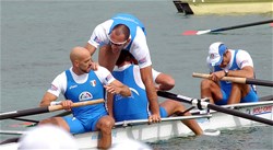 Alessio Sartori (2) moves in the boat to congratulate his stroke, Lorenzo Carboncini after winning silver in the men's four at the 2007 World Rowing Championships in Munich, Germany.